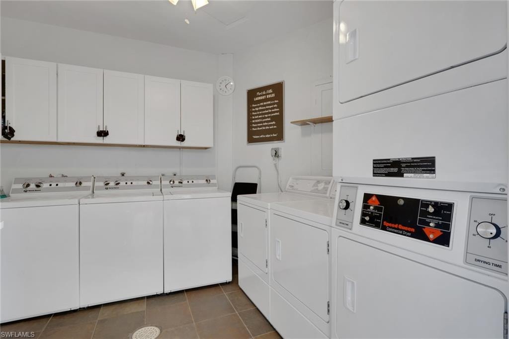 Shared laundry room featuring washer and clothes dryer