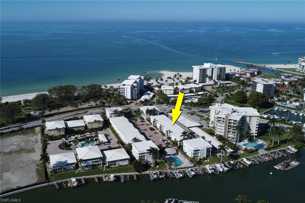 Aerial overview of property's location featuring a large body of water
