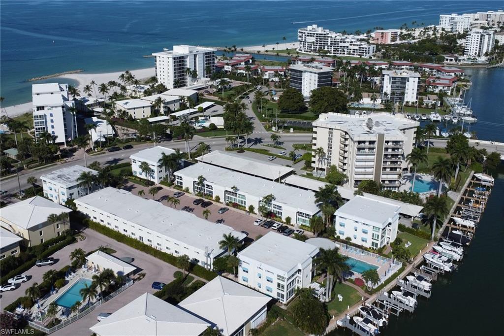 View of property location featuring a nearby body of water and nearby urban area