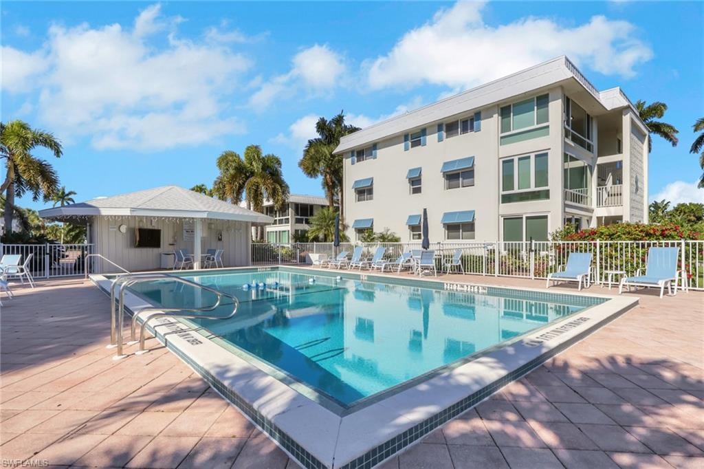 Community pool with a patio area