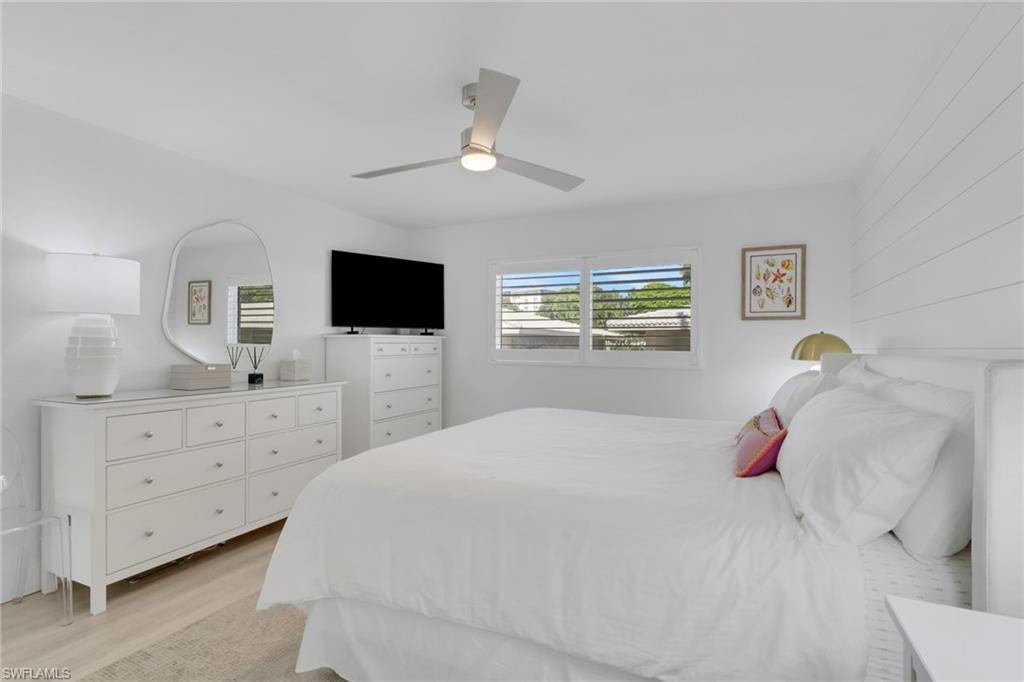 Bedroom featuring light wood-type flooring and a ceiling fan