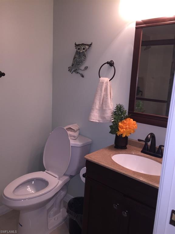 Half bath with vanity and toilet