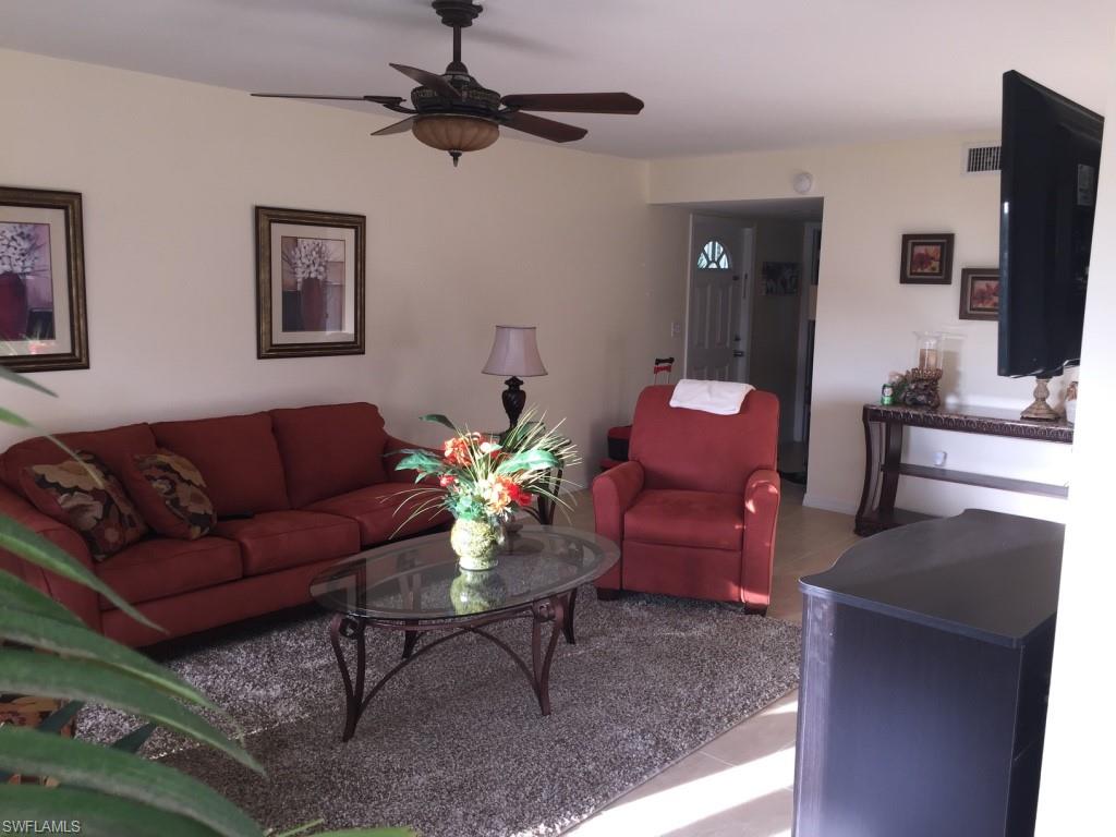 Tiled living area with a ceiling fan