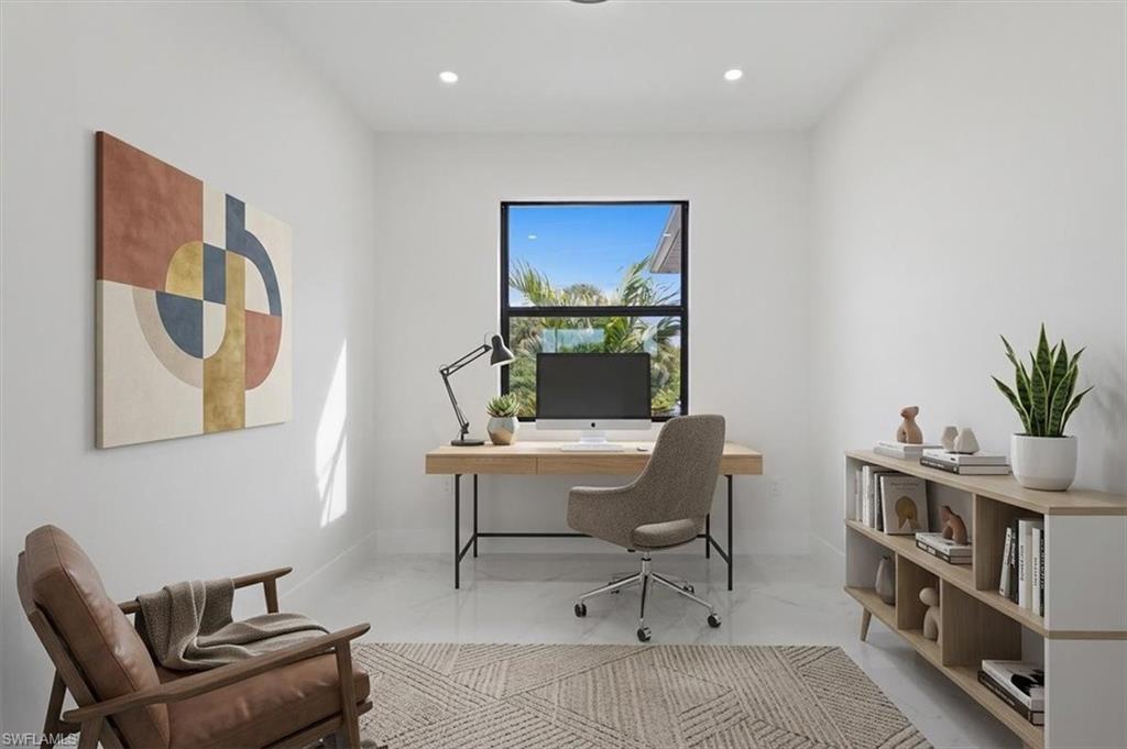 Well-lit room with recessed lighting and a single window