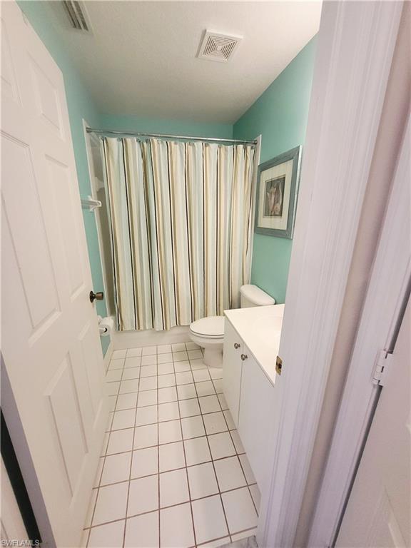 Bathroom featuring vanity and light tile patterned floors