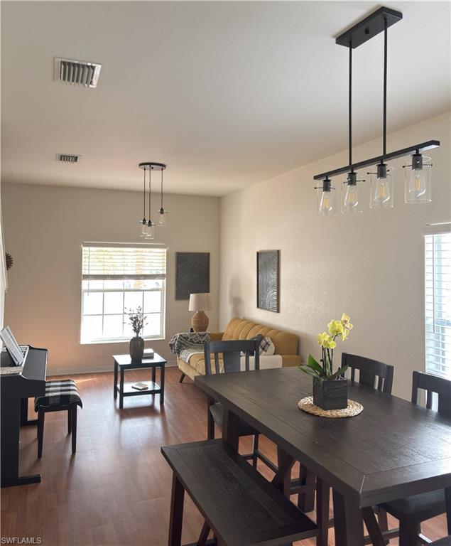 Dining space with wood finished floors