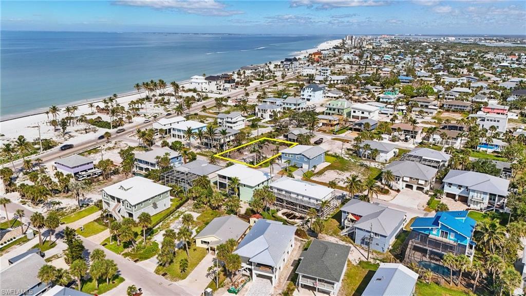 Aerial perspective of suburban area with a view of the gulf