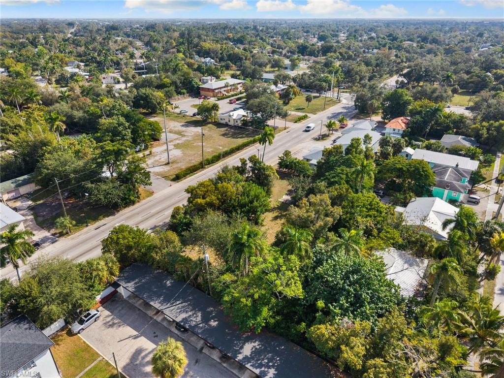 Aerial view of property's location with nearby suburban area