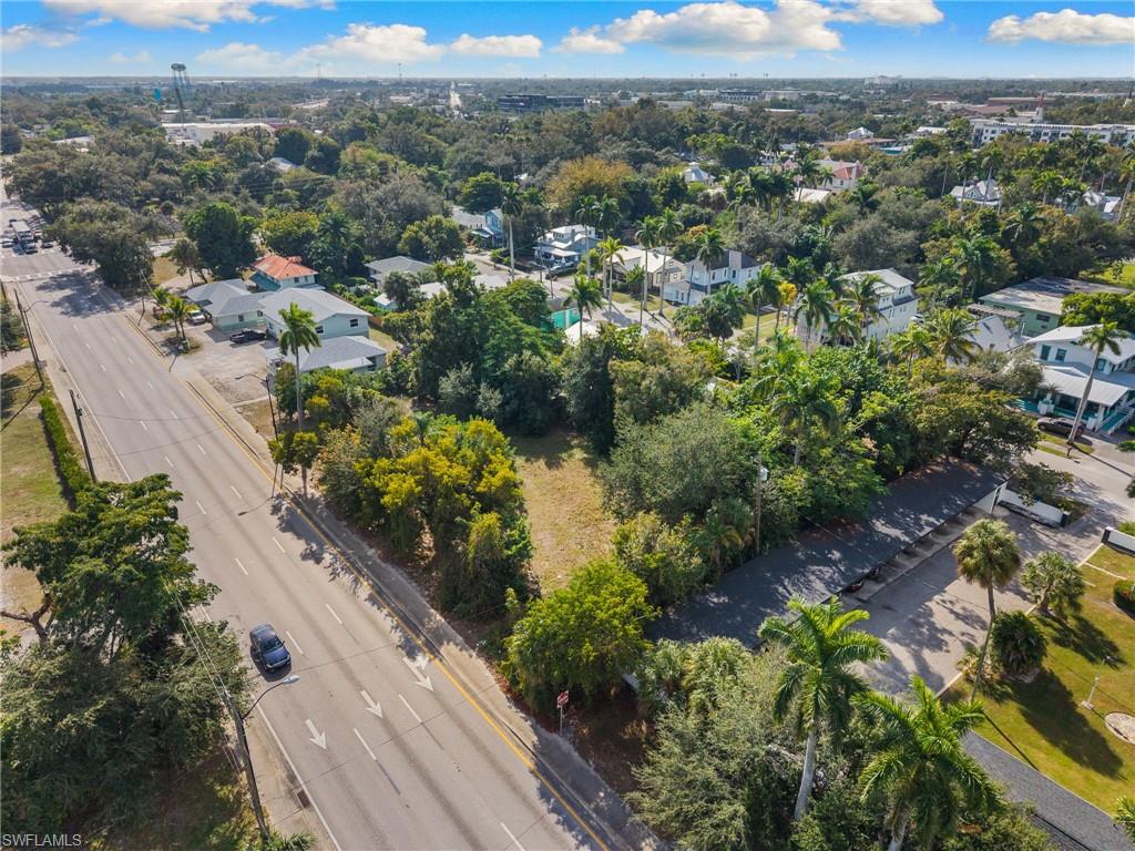 Aerial view of property's location with nearby suburban area