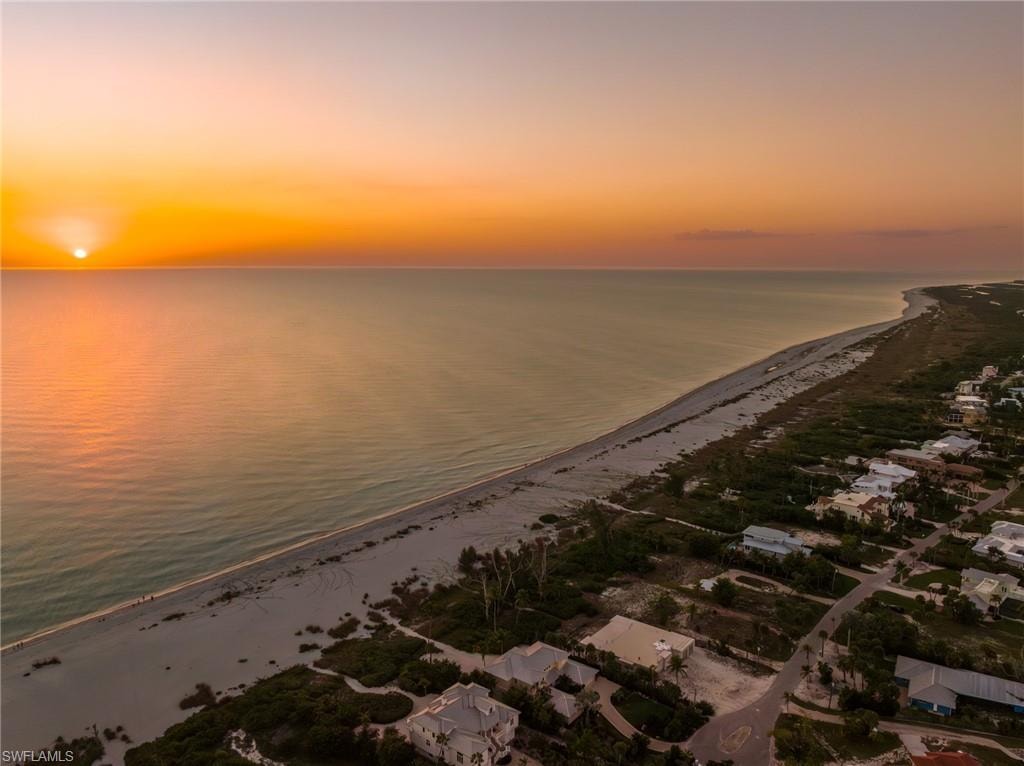 Water view featuring local beach and nearby suburban area