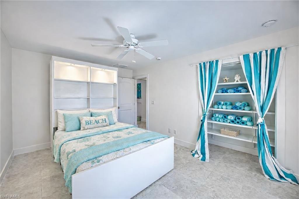 Bathroom featuring vanity and shower / bath combination with curtain