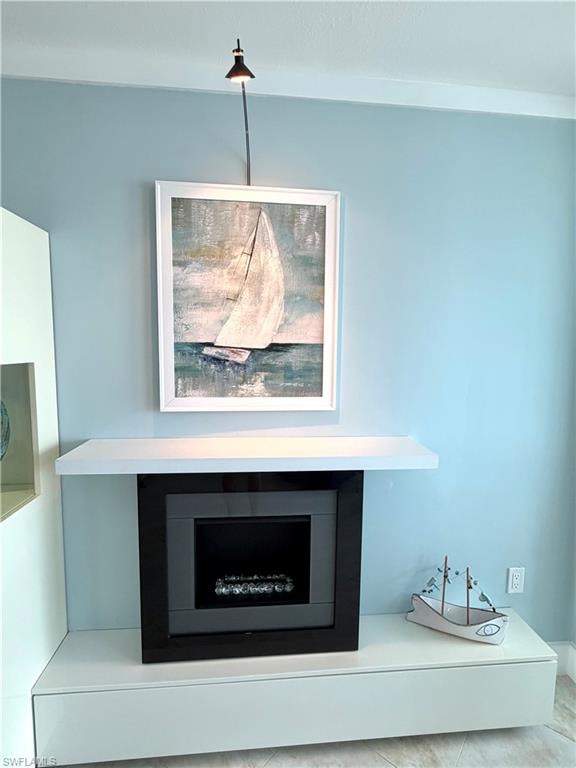 Built-in beverage refrigerator with clear glass door, wood-finish shelving, and integrated lighting
