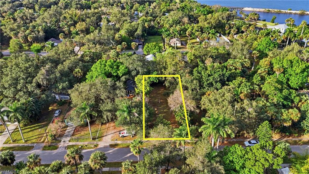 Aerial overview of property's location with a large body of water