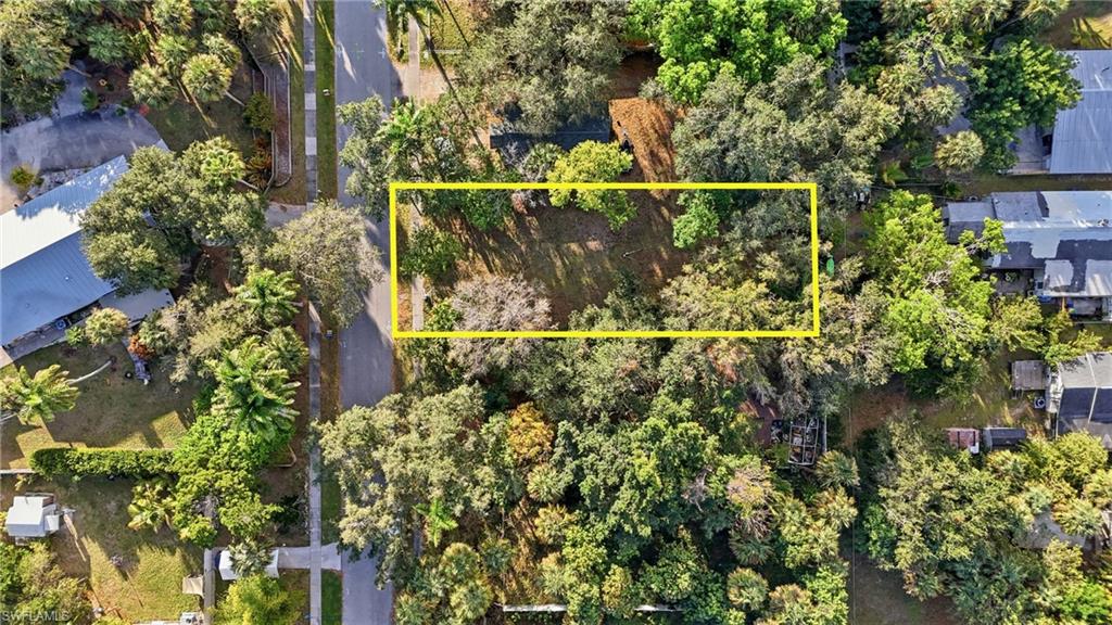 Aerial view of property's location featuring property parcel outlined and a nearby body of water