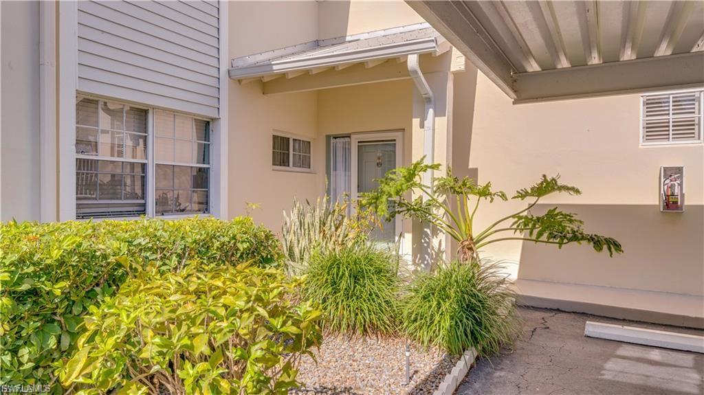 Doorway to property with stucco siding