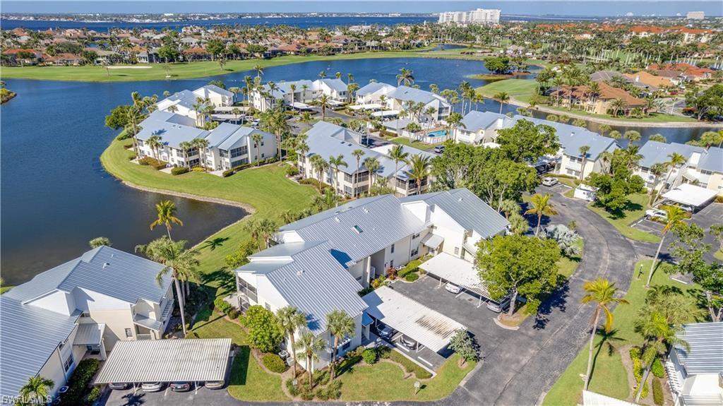 Aerial view of residential area featuring a large body of water