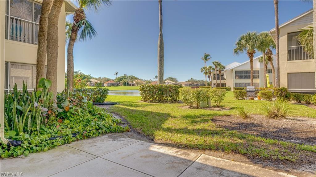 View of green lawn with a water view