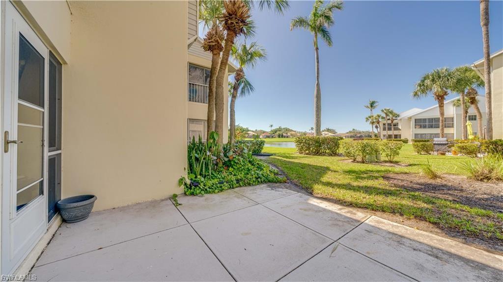 View of patio with a water view