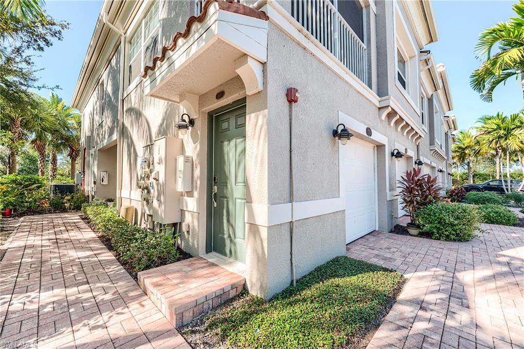 Entrance to property with stucco siding