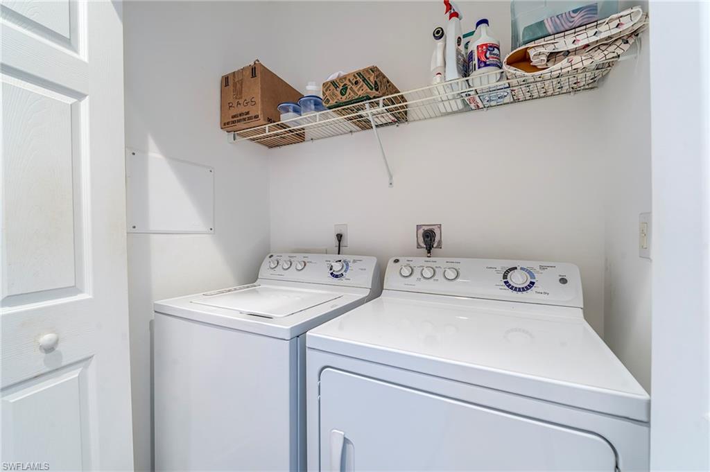 Washroom featuring independent washer and dryer