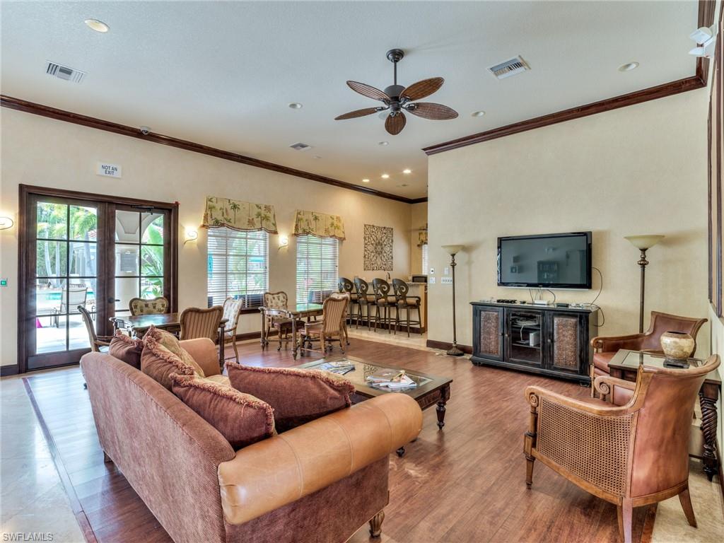 Living area with french doors, crown molding, wood finished floors, a ceiling fan, and recessed lighting