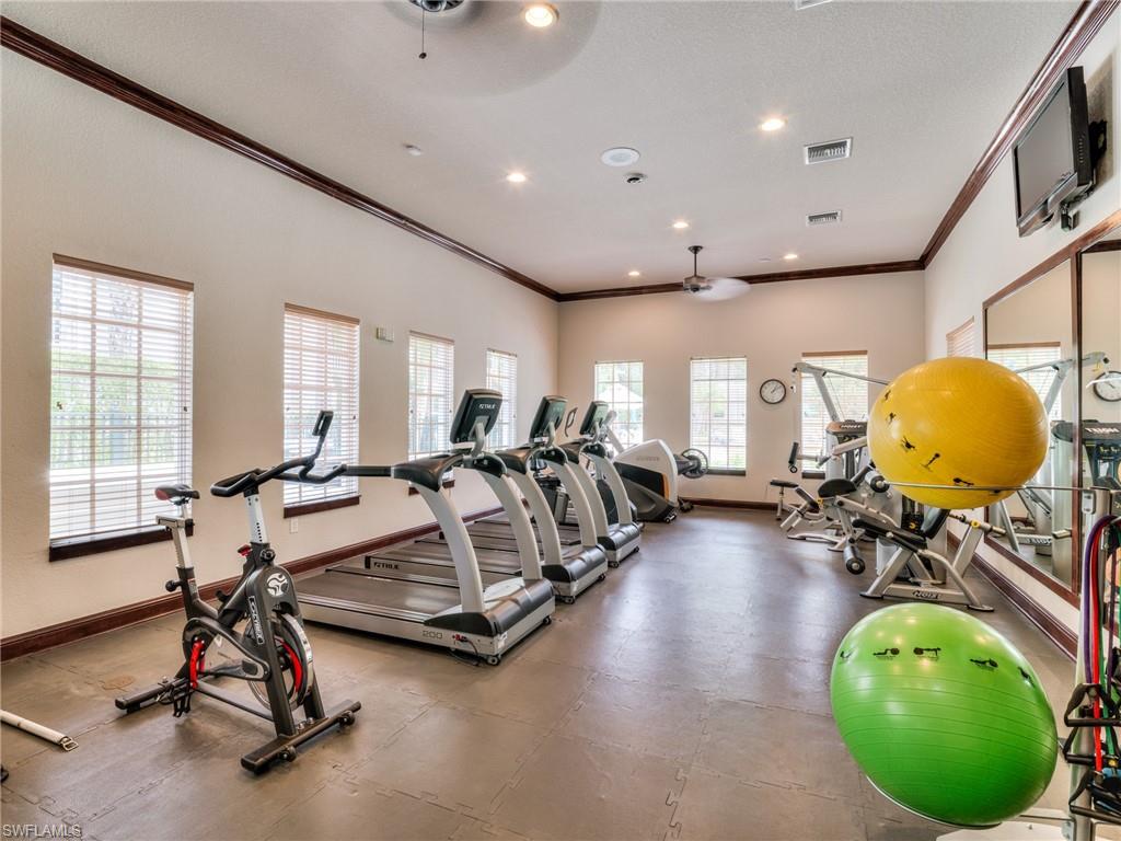 Workout area with crown molding, ceiling fan, recessed lighting, and a textured ceiling