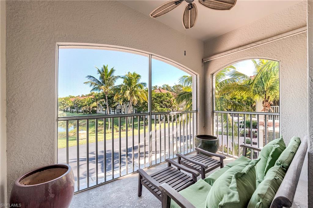 Sunroom / solarium featuring a water view
