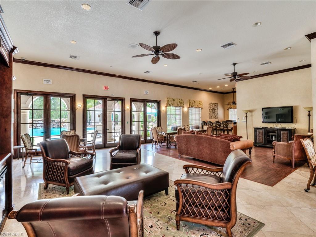 Living room with ornamental molding, healthy amount of natural light, ceiling fan, recessed lighting, and a textured ceiling