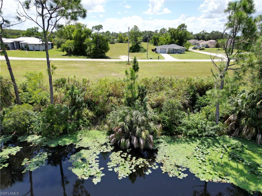 View of yard with a water view
