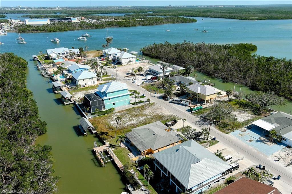 Aerial perspective of suburban area with a large body of water