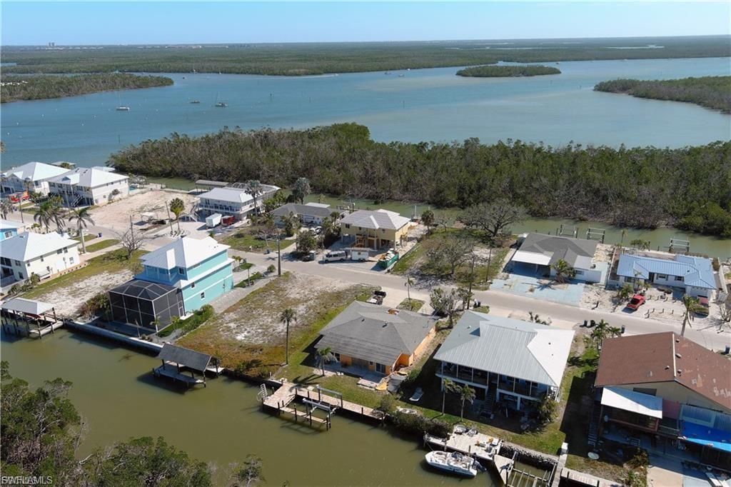 Aerial view of residential area with a nearby body of water