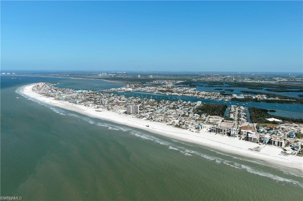 Drone / aerial view of waterfront with a beach
