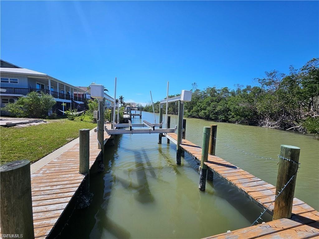 Dock featuring a water view and boat lift
