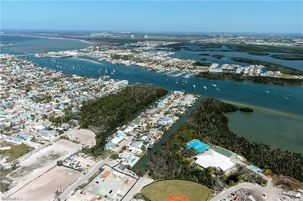 Aerial view of property's location featuring a large body of water