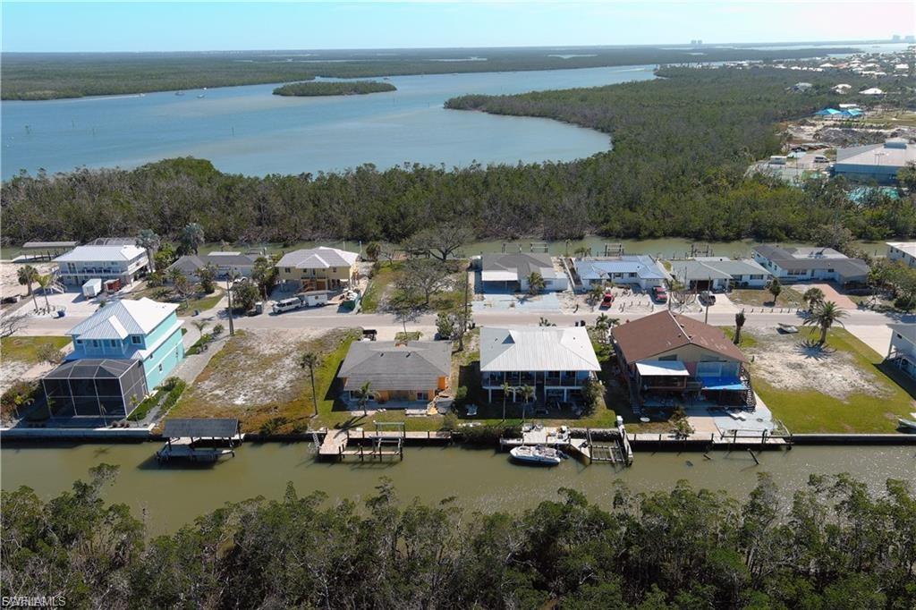 Aerial view of residential area with a nearby body of water