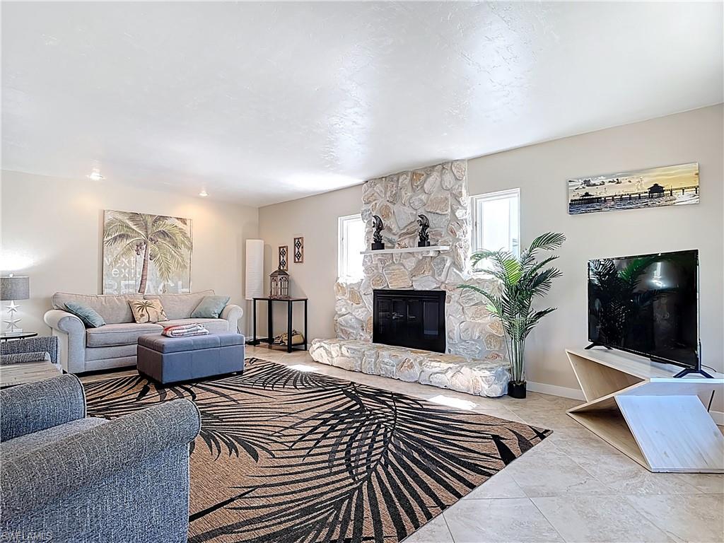 Living area featuring a fireplace and baseboards