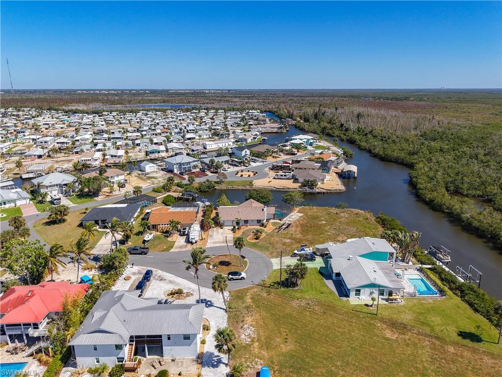Aerial perspective of suburban area with a nearby body of water