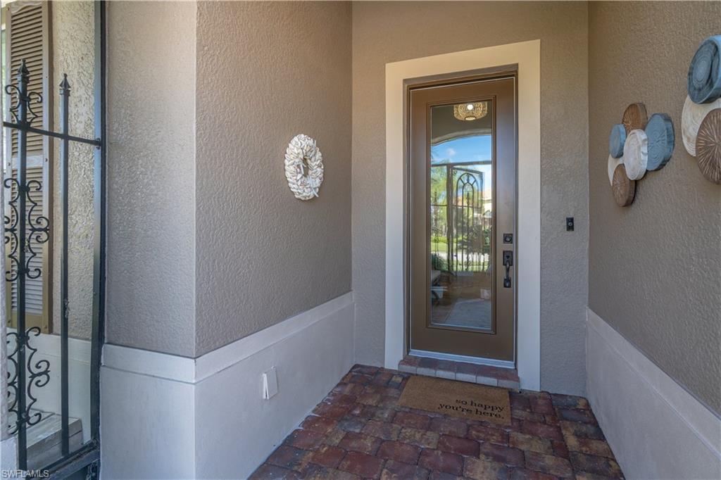 Entrance to property featuring stucco siding