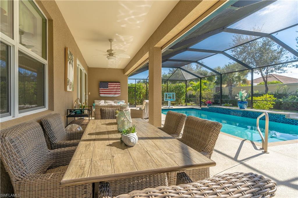 Outdoor pool with a patio, a sunroom, a lanai, an outdoor hangout area, and outdoor dining area