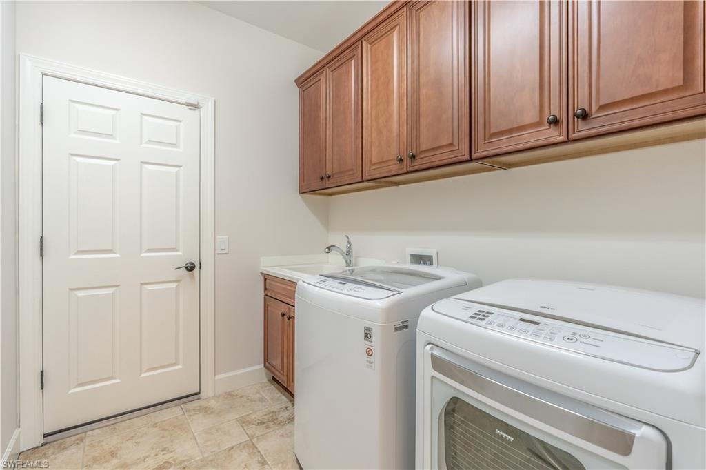 Washroom with cabinet space and independent washer and dryer