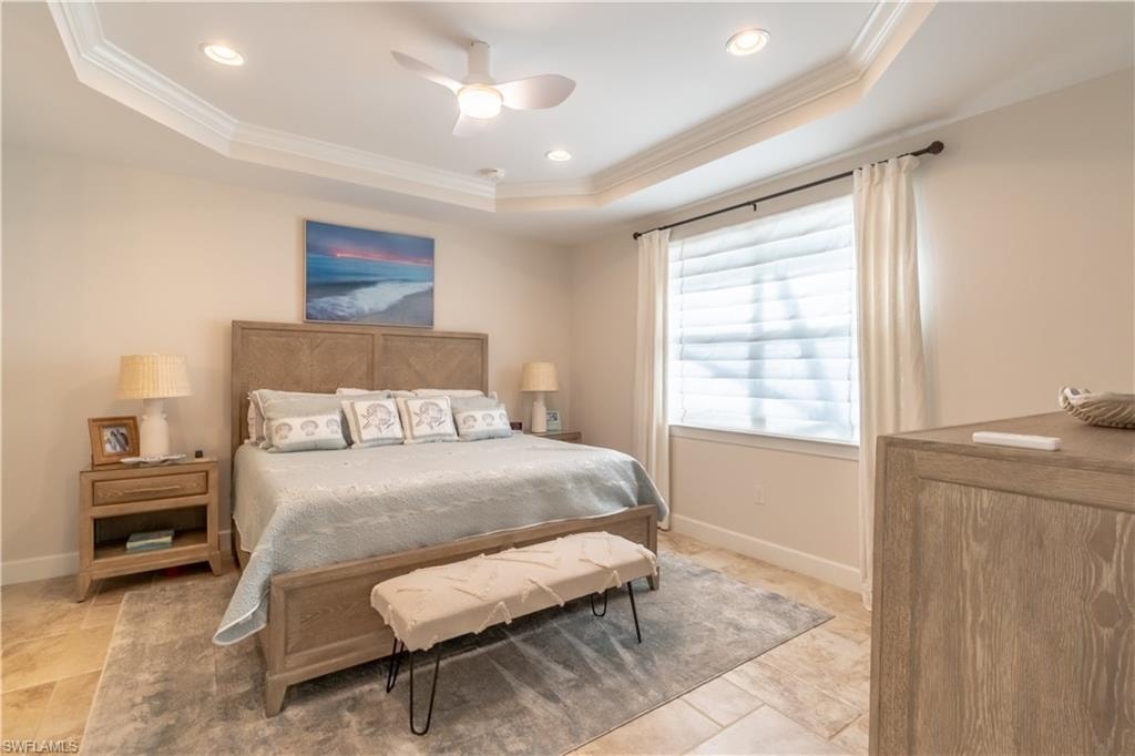 Bedroom featuring crown molding, a ceiling fan, recessed lighting, and a raised ceiling