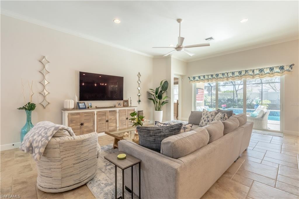Living area featuring ornamental molding, a ceiling fan, and recessed lighting