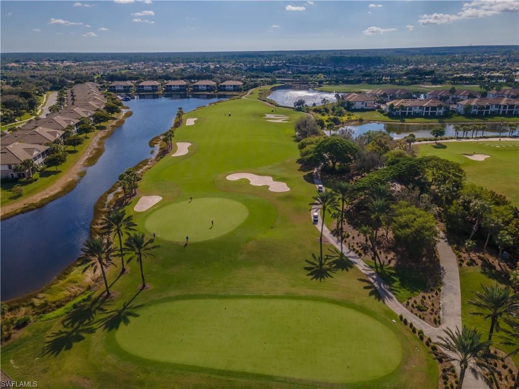 View of property location featuring a golf club and nearby suburban area