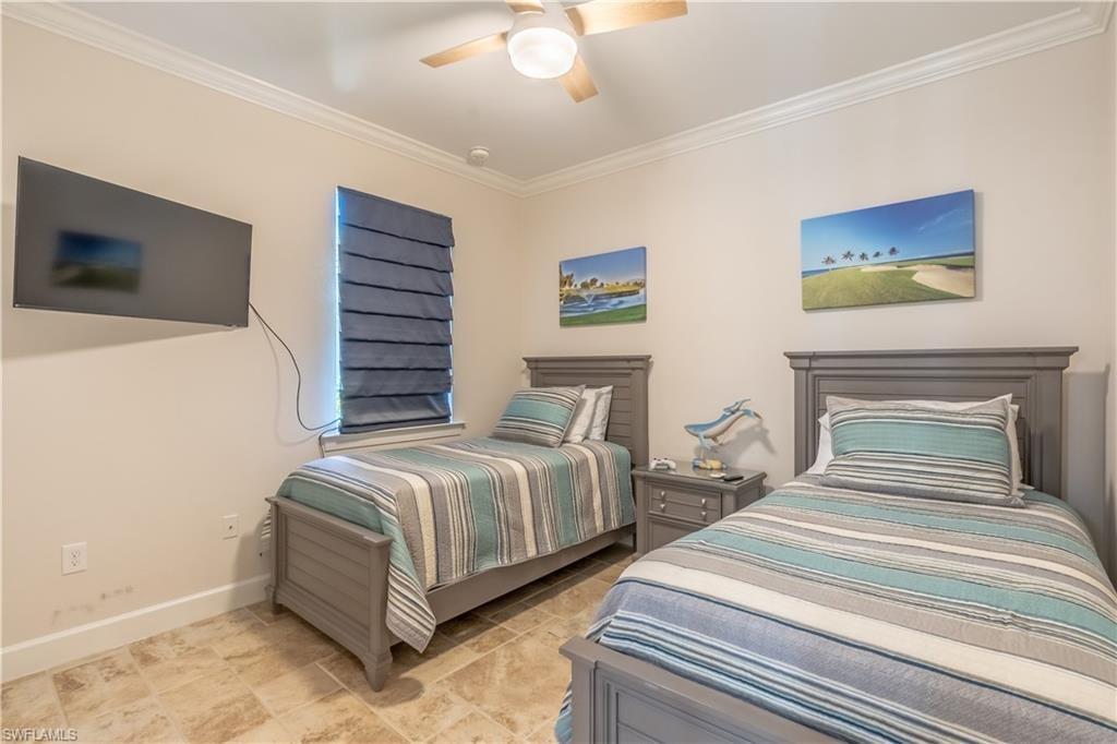 Bedroom featuring ornamental molding and ceiling fan