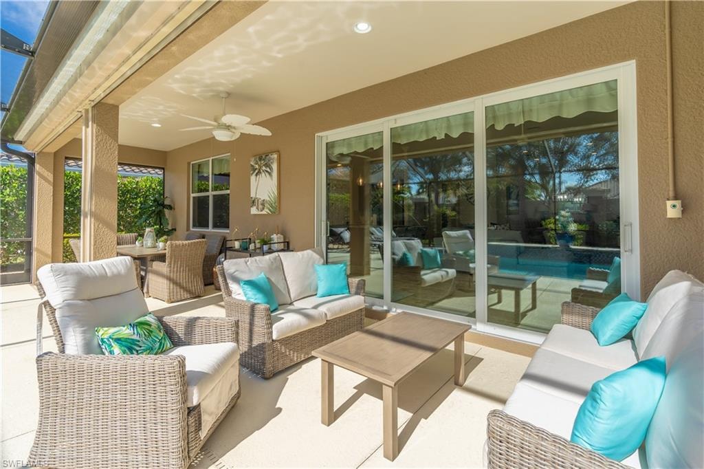 View of patio / terrace with an outdoor living space, ceiling fan, and outdoor dining area