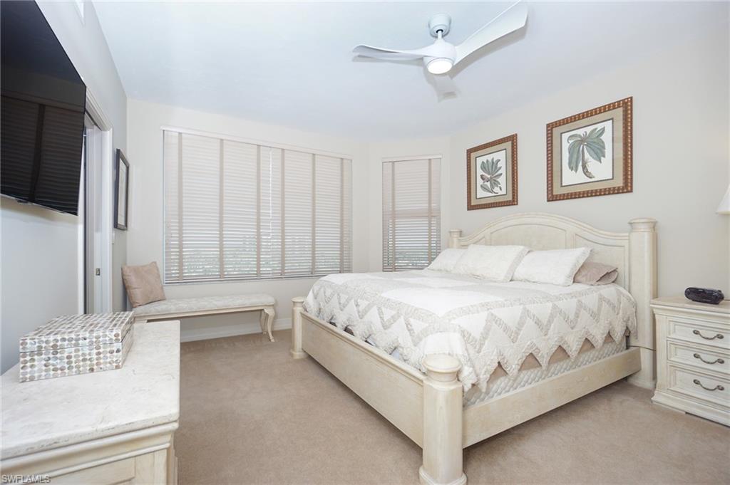 Bedroom featuring light colored carpet and ceiling fan