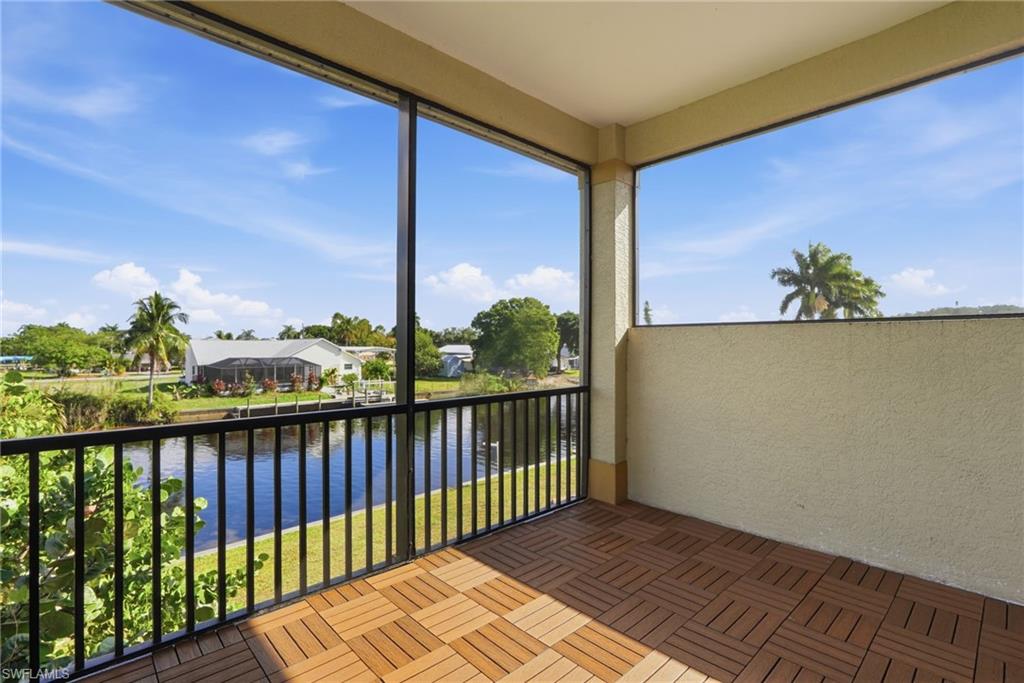 Unfurnished sunroom featuring a water view