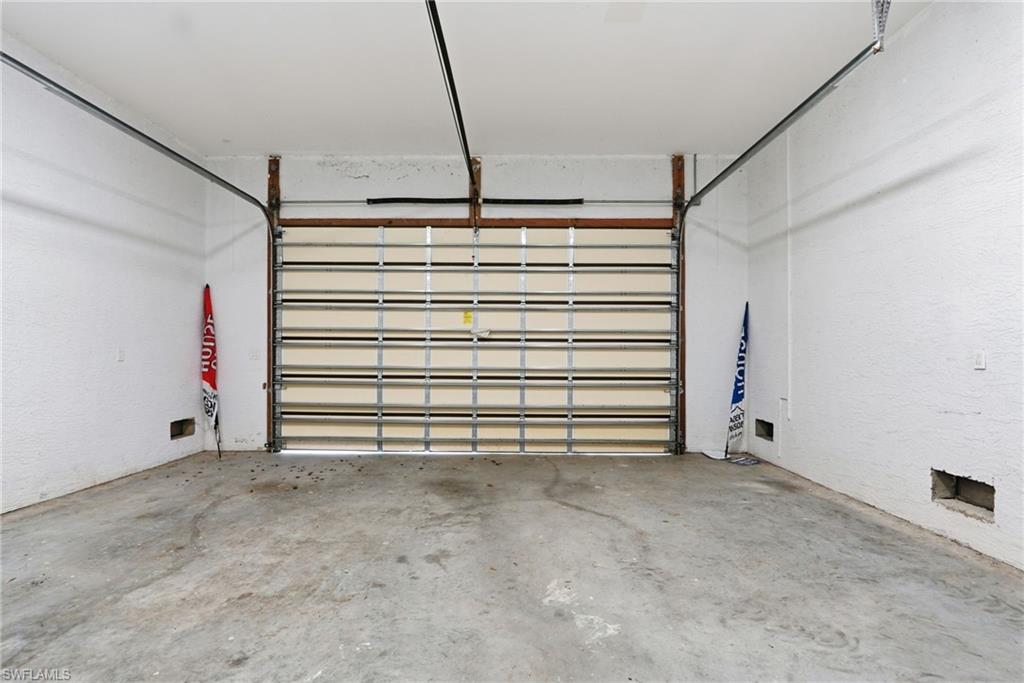 Large and deep garage with high ceilings perfect for vehicles and your Florida Life toys