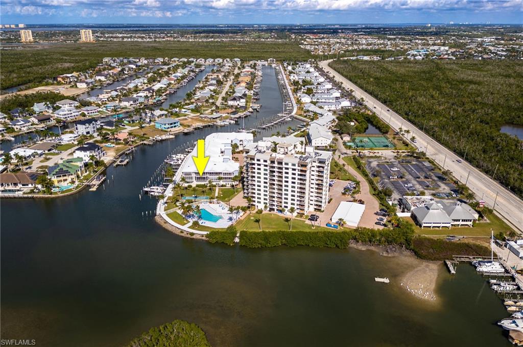 Aerial overview of property's location featuring a nearby body of water