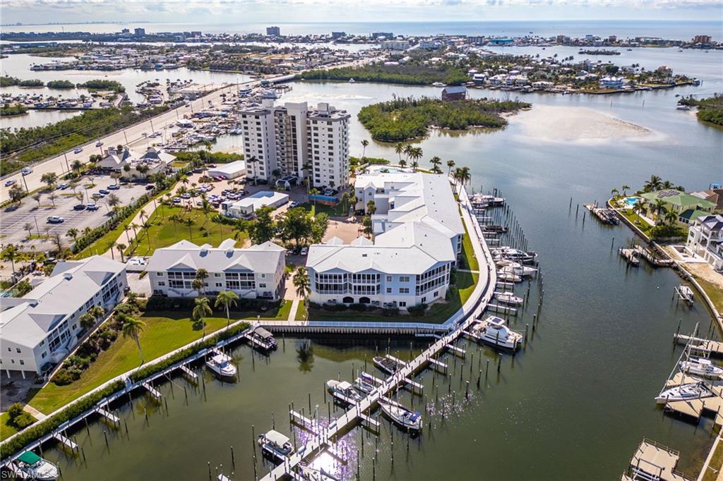 Drone / aerial view of a marina and a nearby body of water